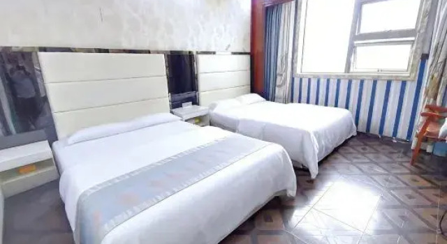 Bett im Wohnheim Xinglong Hostel