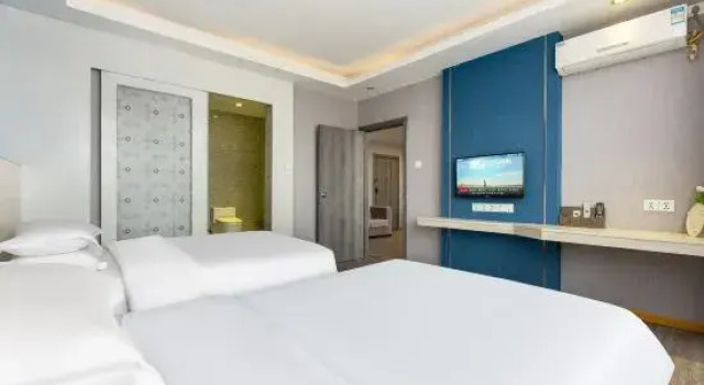 Четырёхместный люкс Orange Fruit Fashion Hotel (Dongguan Dalang Global Plaza)
