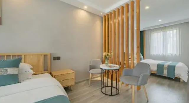 Кровать в общем номере Anji Luohuaju Homestay