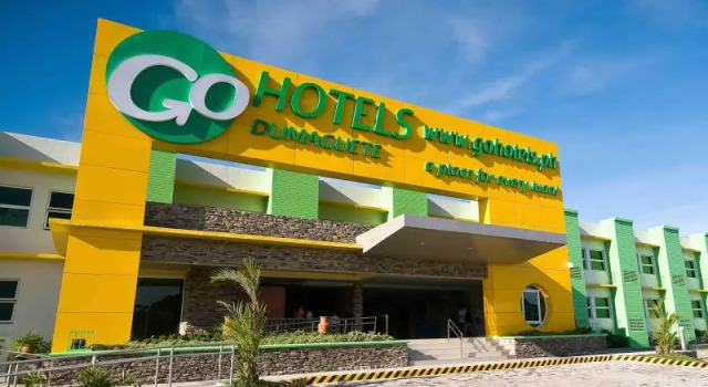 Кровать в общем номере Go Hotels Dumaguete