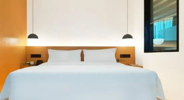 Двухместный люкс Huayi Hotel