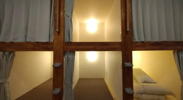 Кровать в общем номере Keimichi Guest House