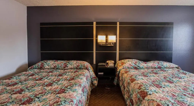 Четырёхместный номер Standard Coratel Inn & Suites by Jasper Hastings