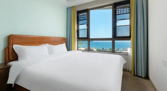 Люкс с 2 комнатами с балконом и с видом на море Chenxi Scenic Apartment (Shenzhou Peninsula)