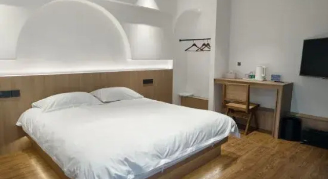 Кровать в общем номере с 6 комнатами Suzhou Xunmi Banshan Homestay