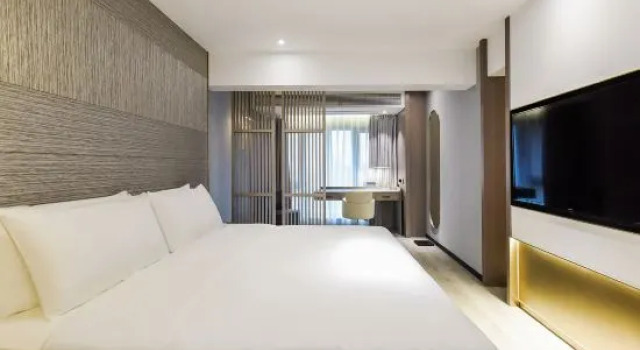 Люкс Business Kuanrong Suites Hotel (Liangjiang love sea shopping park)