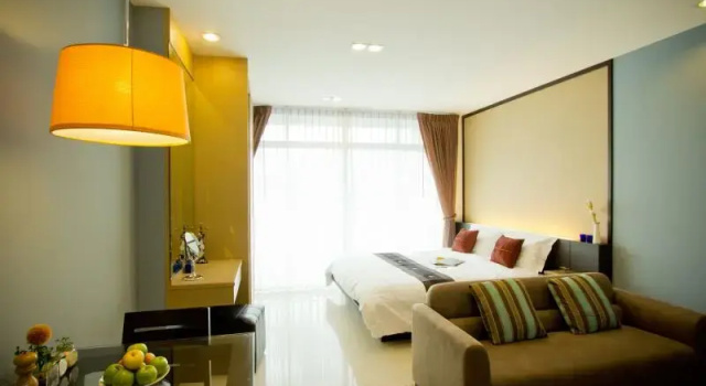 Кровать в общем номере The Grand Wipanan Residence