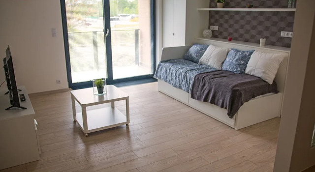 Premium- lejlighed med altan med udsigt over gårdspladsen Trinity Residence