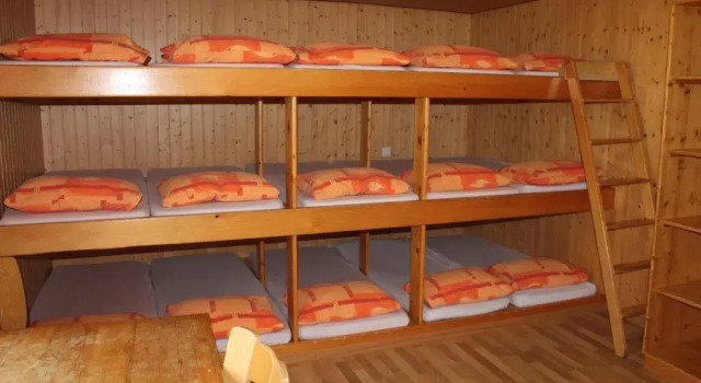 Кровать в общем номере Pension St. Jakob