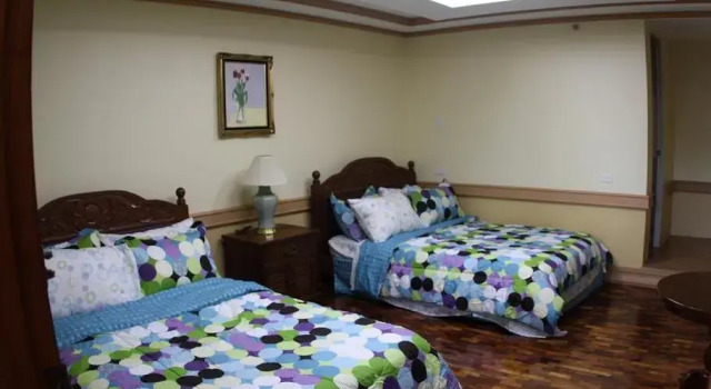 Кровать в общем номере Ascendo Suites