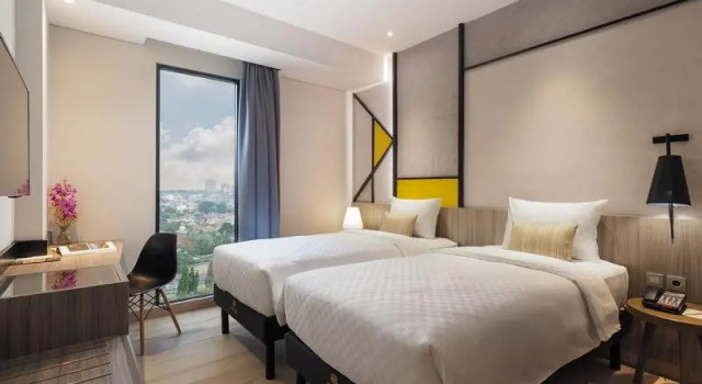 Кровать в общем номере Arosa Hotel Jakarta