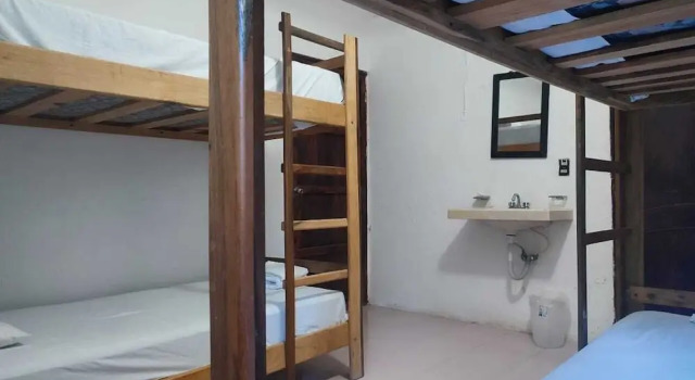 Кровать в общем номере Posada Hondumar