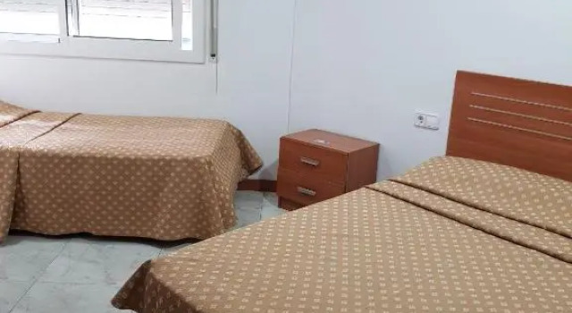 Кровать в общем номере Hostal Europa