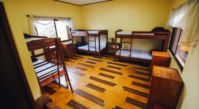Кровать в общем номере Pannzian Beach Resort