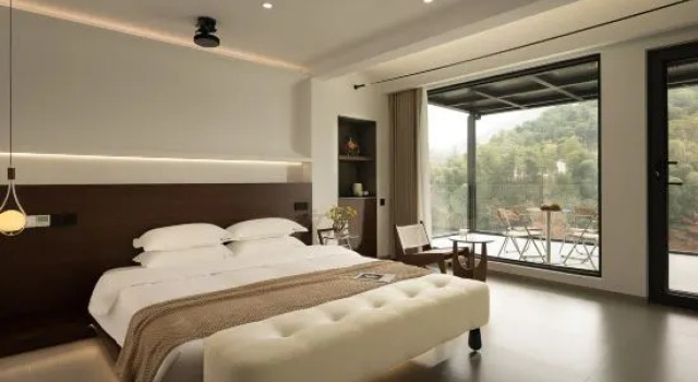 Кровать в общем номере с 2 комнатами Anji see u warm Scene  Hot Spring Beauty Stay (Yunshang Grassland)