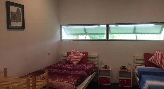Кровать в общем номере Pai Yard Guest House