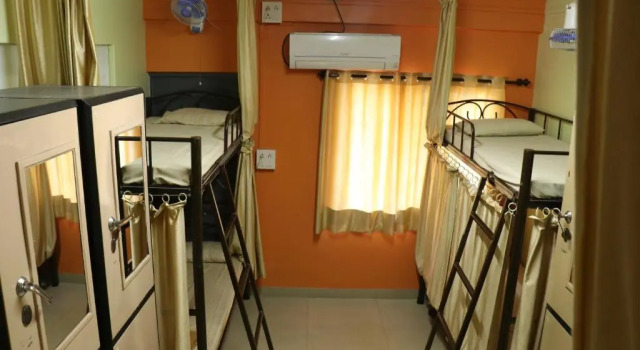 Кровать в общем номере Ashirwad Guest House