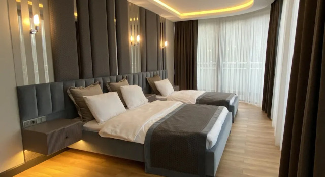 Трёхместный номер Deluxe c 1 комнатой с балконом Voice Hotel