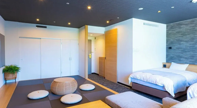 Кровать в общем номере с 6 комнатами Hotel Flags Sasebo KujuKusima
