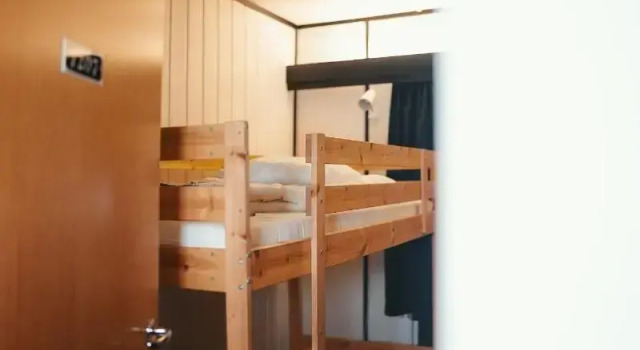 Кровать в общем номере Gjestehuset102