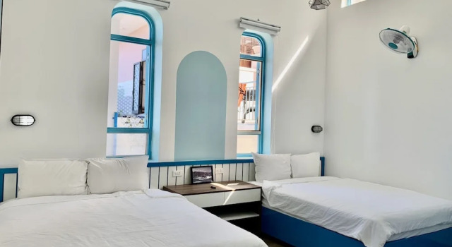 Кровать в общем номере Chai Village Hotel