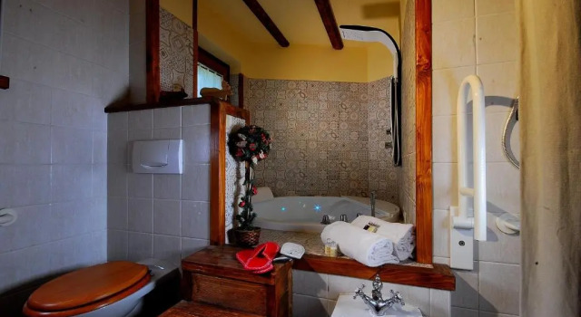 Люкс Deluxe Aparthotel Foyer dantan SUITE con caminetto hammam o vasca idromassaggio