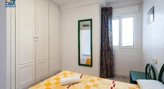 Кровать в общем номере с 3 комнатами с балконом Residencial Casablanca Casa Azahar