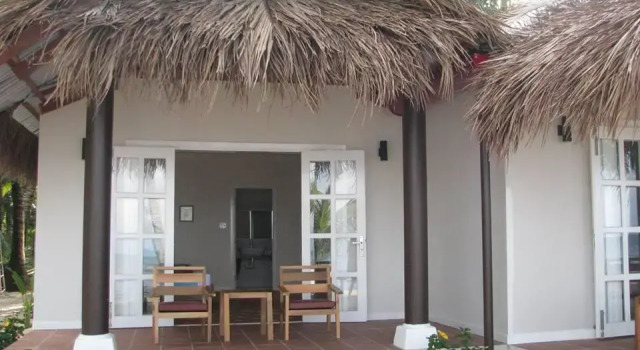 Кровать в общем номере Peppercorn Beach Resort