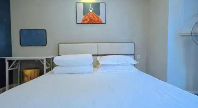 Семейный люкс с 2 комнатами Mudanjiang Yikai Apartment