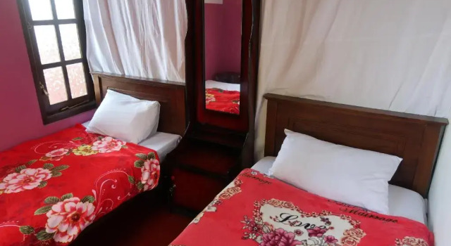 Кровать в общем номере The Mist Holiday Bungalow