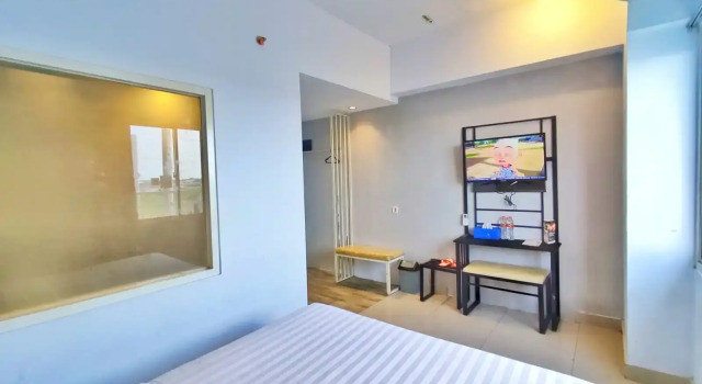 Camera Deluxe De La Charis Hotel by Waringin Hospitality