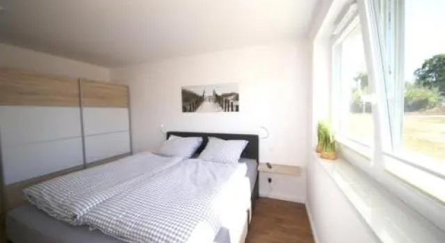 Ferienwohnung Dünenhäuser App. A2, Забронировать Отель Шарбойц Holstein Switzerland, рядом с Пляж Hundestrand