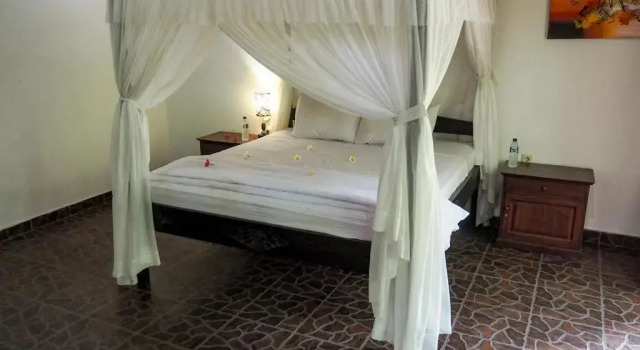 Кровать в общем номере Scuba Tribe Bali dive-resort