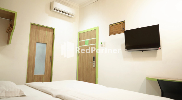 Номер Deluxe Wisma Sederhana Medan Mitra RedDoorz