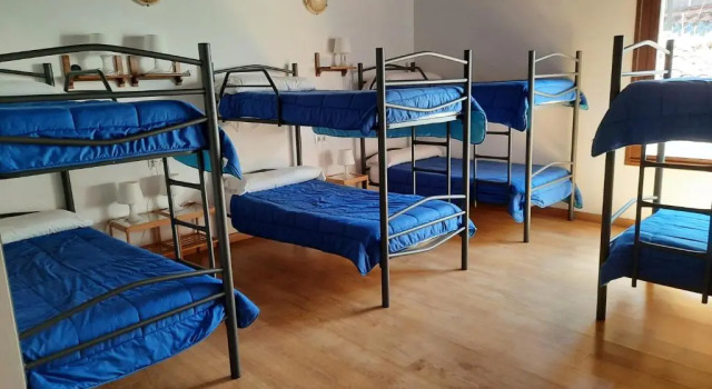 Кровать в общем номере La Casa de Mi Abuela