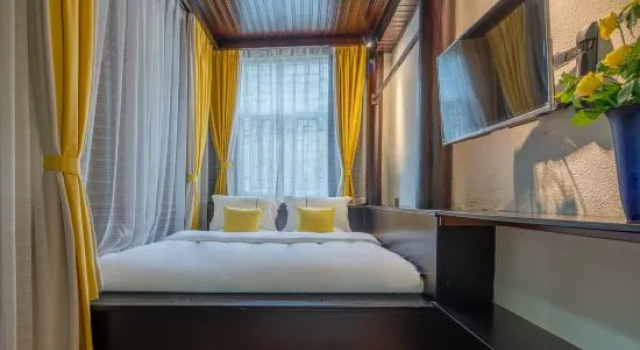 Четырёхместный люкс Mohe Shuxin Panoramic Hot Spring Homestay (Heshun Ancient Town Jiajia Dam)