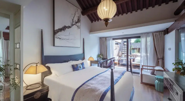 Кровать в общем номере Beijing Lezai Nanluo Countyard Hotel