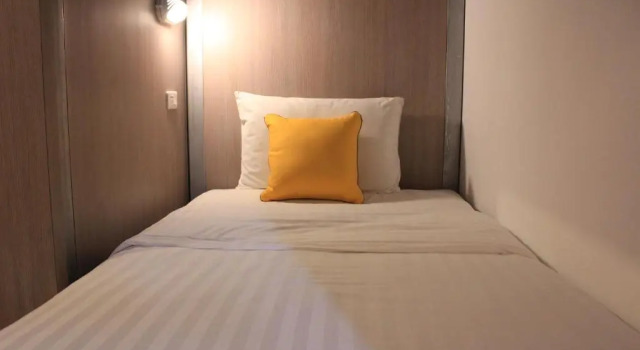 Кровать в общем номере Wake Up Aonang Hotel