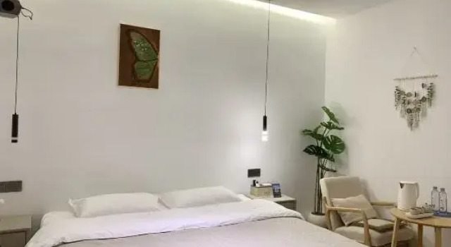 Кровать в общем номере Tangwu Courtyard B&B