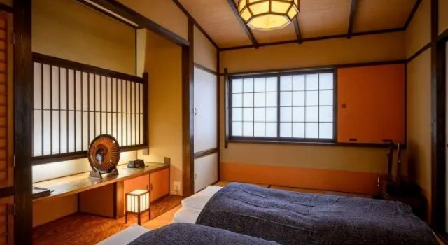 Кровать в общем номере Iwai Onsen Iwaiya