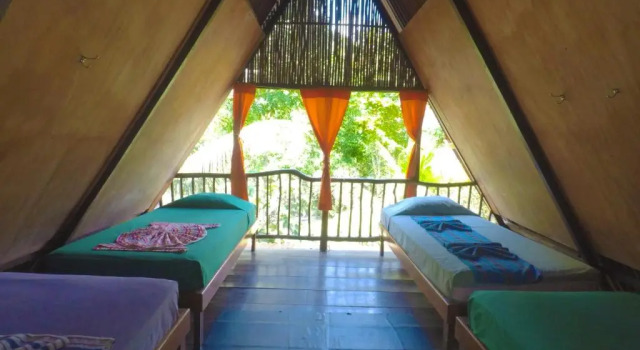 Кровать в общем номере El Portal De Champey