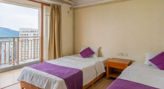 Кровать в общем номере с 3 комнатами с частичным видом на море Fengfan Resort Apartment (Zhapo Dajiaowan Water Park)
