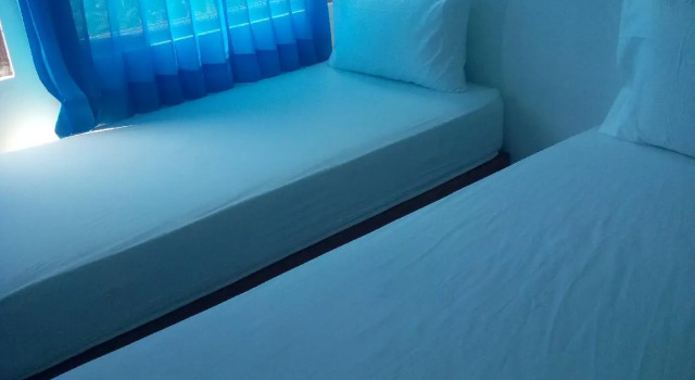 Кровать в общем номере Beji Bay Resort