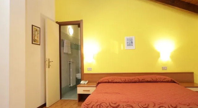 Camera quadrupla mansarda Hotel Il Chiostro by LVG Hotel Collection