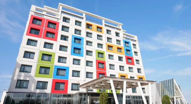 Кровать в общем номере Larchotel
