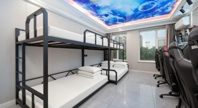 Кровать в общем номере Aibo E-sports Hotel (Taiyuan Zhongzheng Branch)