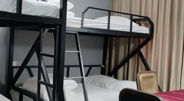 Кровать в общем номере Huaxi Xiangli Hotel
