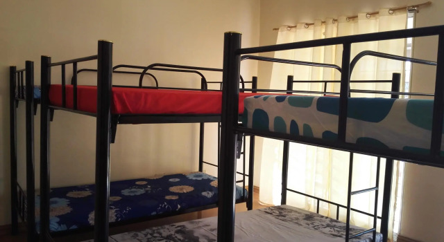 Кровать в общем номере Happy To Mingle Hostel @ Manila Airport