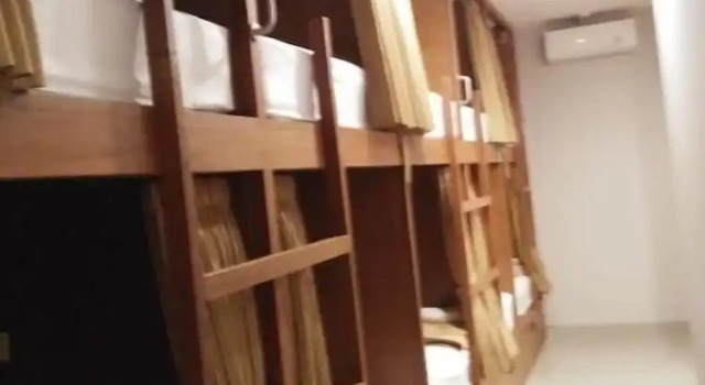 Кровать в общем номере Made House Homestay and Dormitory