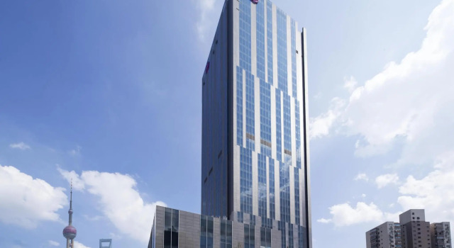 Кровать в общем номере Sheraton Shanghai Hongkou Hotel